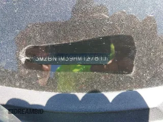 2017 Mazda 3 Grand Touring z VIN 3MZBN1M39HM127811, wystawiony jako IAAI lot #42060315 z przebiegiem Nie podano mil oraz . Historia ofert i sprzedaży dostępna na DreamBid. Obrazek 9.