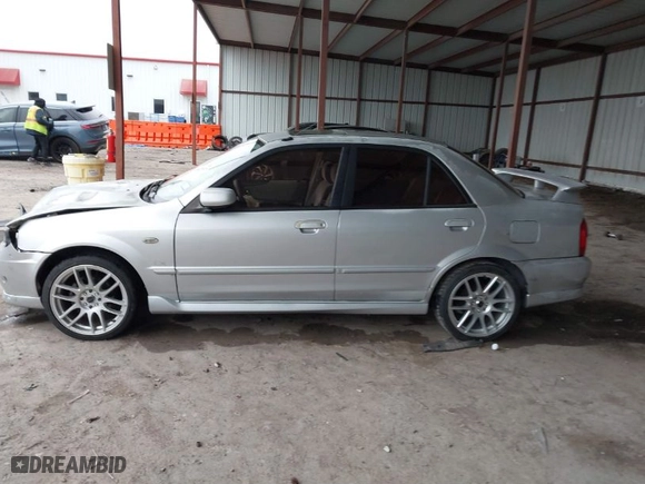 2003 Mazda Protege DX with VIN JM1BJ225030124381, listed as a IAAI auction lot 41607937 with 141,484 mi miles. Bid and sale history available at carsss.com. Image 14.