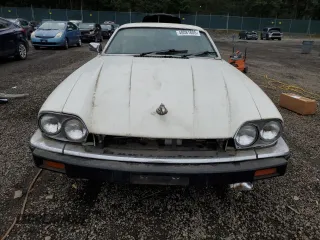 1989 Jaguar XJS z VIN SAJNA5840KC150684, wystawiony jako Copart lot #48081805 z przebiegiem 93 444 mil mil oraz Czysty tytuł • Clean title. Historia ofert i sprzedaży dostępna na DreamBid. Obrazek 5.