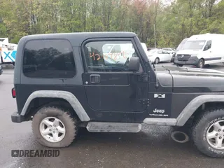 2004 Jeep Wrangler X with VIN 1J4FA39S94P707411, listed as a IAAI auction lot 42187856 with 189,519 mi miles. Bid and sale history available at carsss.com. Image 13.