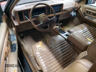 1988 Cadillac Eldorado z VIN 1G6EL1154JU615807, wystawiony jako Copart lot #76362924 z przebiegiem Nie podano mil oraz Tytuł czysty. Historia ofert i sprzedaży dostępna na DreamBid. Obrazek 8.