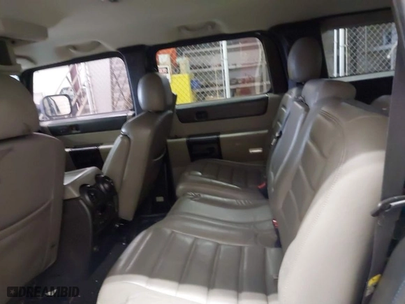 2005 Hummer H2 SUV with VIN 5GRGN23U65H132505, listed as a IAAI auction lot 41515346 with 140,944 mi miles. Bid and sale history available at carsss.com. Image 8.