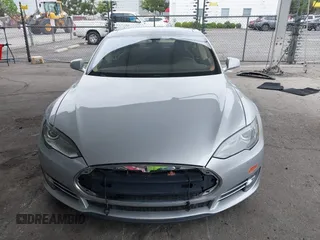 2014 Tesla Model S 60 with VIN 5YJSA1H12EFP32213, listed as a IAAI auction lot 42194085 with 56,071 mi miles and . Bid and sale history available at DreamBid. Image 13.