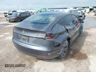2023 Tesla Model 3 with VIN 5YJ3E1EA5PF676316, listed as a IAAI auction lot 42384765 with 33,715 mi miles and . Bid and sale history available at DreamBid. Image 4.