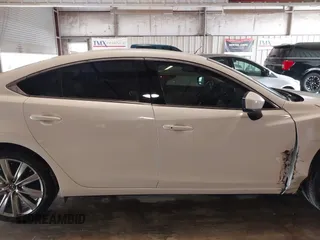 2021 Mazda 6 Carbon Edition with VIN JM1GL1WY9M1614117, listed as a IAAI auction lot 41305576 with 54,670 mi miles and . Bid and sale history available at DreamBid. Image 13.