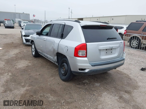 2011 Jeep Compass with VIN 1J4NT1FA7BD142600, listed as a IAAI auction lot 41590661 with 266,600 mi miles. Bid and sale history available at carsss.com. Image 3.
