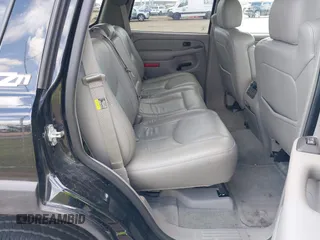 2004 Chevrolet Tahoe Z71 with VIN 1GNEK13ZX4R184775, listed as a IAAI auction lot 42433671 with 77,019 mi miles and . Bid and sale history available at DreamBid. Image 8.