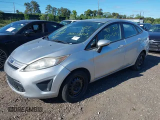 2013 Ford Fiesta S with VIN 3FADP4AJ6DM223132, listed as a IAAI auction lot 42317500 with 104,003 mi miles and . Bid and sale history available at DreamBid. Image 2.