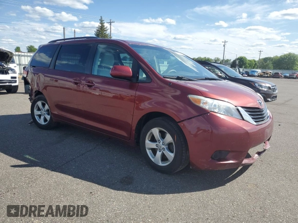 2012 Toyota Sienna LE AAS with VIN 5TDKK3DC7CS195590, listed as a Copart auction lot 57968415 with 201,732 mi miles and Salvage title. Bid and sale history available at DreamBid. Image 4.