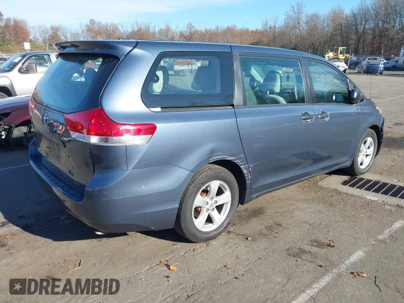 2014 Toyota Sienna L with VIN 5TDZK3DC0ES413970, listed as a IAAI auction lot 40870422 with 138,589 mi miles. Bid and sale history available at carsss.com. Image 4.