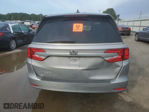2018 Honda Odyssey EX-L with VIN 5FNRL6H74JB099282, listed as a Copart auction lot 55031025 with 137,359 mi miles and Salvage Title. Bid and sale history available at DreamBid. Image 6.