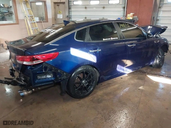 2016 Kia Optima LX with VIN 5XXGT4L33GG026572, listed as a IAAI auction lot 41514872 with 135,423 mi miles. Bid and sale history available at carsss.com. Image 4.