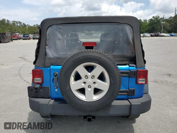 2015 Jeep Wrangler Unlimited Willys Wheeler with VIN 1C4BJWDG4FL611656, listed as a Copart auction lot 54010395 with 129,797 mi miles and Salvage Title. Bid and sale history available at DreamBid. Image 6.