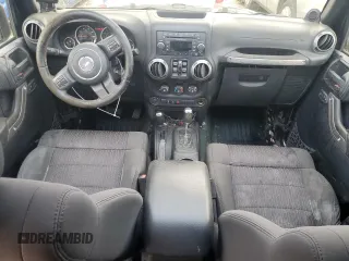2012 Jeep Wrangler Unlimited Sport z VIN 1C4BJWDG3CL181596, wystawiony jako Copart lot #57940655 z przebiegiem 168 882 mil mil oraz Czysty tytuł • Clean title. Historia ofert i sprzedaży dostępna na DreamBid. Obrazek 8.