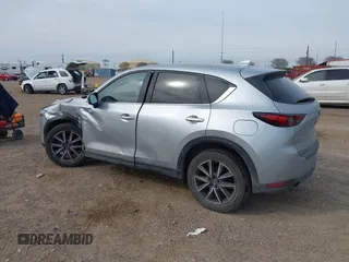2017 Mazda CX-5 Grand Touring with VIN JM3KFBDL8H0227348, listed as a IAAI auction lot 41572377 with 124,908 mi miles. Bid and sale history available at carsss.com. Image 3.