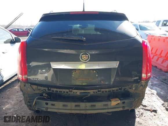 2014 Cadillac SRX Premium Collection z VIN 3GYFNDE34ES581728, wystawiony jako IAAI lot #41578226 z przebiegiem 121 118 mil mil oraz . Historia ofert i sprzedaży dostępna na DreamBid. Obrazek 17.