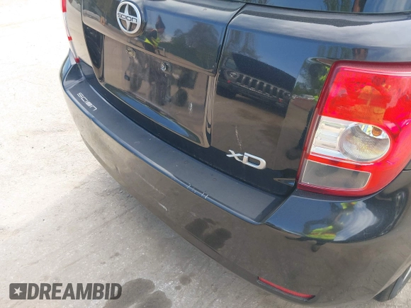 2009 Scion xD with VIN JTKKU10409J041654, listed as a IAAI auction lot 42036558 with 122,661 mi miles. Bid and sale history available at carsss.com. Image 6.