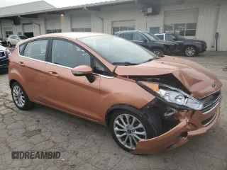 2017 Ford Fiesta Titanium with VIN 3FADP4FJ8HM164132, listed as a Copart auction lot 82577424 with 63,686 mi miles and Salvage Title. Bid and sale history available at DreamBid. Image 4.