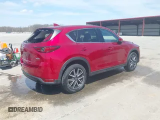 2018 Mazda CX-5 Grand Touring with VIN JM3KFBDM6J0424663, listed as a IAAI auction lot 42003207 with 95,442 mi miles and . Bid and sale history available at DreamBid. Image 4.