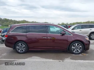 2014 Honda Odyssey Touring with VIN 5FNRL5H9XEB073156, listed as a IAAI auction lot 41990714 with 166,129 mi miles and . Bid and sale history available at DreamBid. Image 13.