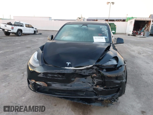 2023 Tesla Model Y Long Range z VIN 7SAYGDEE2PA166042, wystawiony jako IAAI lot #41348960 z przebiegiem Nie podano mil oraz . Historia ofert i sprzedaży dostępna na DreamBid. Obrazek 6.