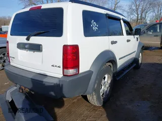 2008 Dodge Nitro SXT with VIN 1D8GU28K18W113714, listed as a IAAI auction lot 41671938 with 118,629 mi miles. Bid and sale history available at carsss.com. Image 4.