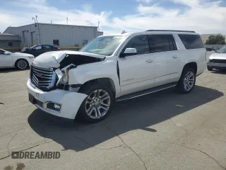 2019 GMC Yukon XL SLT with VIN 1GKS2GKC5KR383231, listed as a Copart auction lot 52649495 with 43,855 mi miles and Salvage Title. Bid and sale history available at DreamBid. Image 1.
