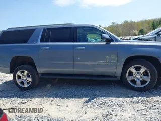 2016 Chevrolet Suburban LT z VIN 1GNSKHKC4GR427591, wystawiony jako IAAI lot #42162723 z przebiegiem 131 771 mil mil oraz . Historia ofert i sprzedaży dostępna na DreamBid. Obrazek 13.