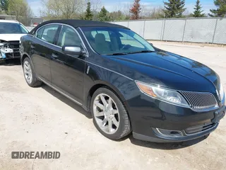 2014 Lincoln MKS z VIN 1LNHL9DK0EG606273, wystawiony jako IAAI lot #42178523 z przebiegiem 285 397 mil mil oraz . Historia ofert i sprzedaży dostępna na DreamBid. Obrazek 1.