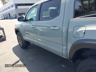 2023 Toyota Tacoma SR with VIN 3TMCZ5AN3PM590101, listed as a IAAI auction lot 42338670 with 12,970 mi miles and . Bid and sale history available at DreamBid. Image 14.