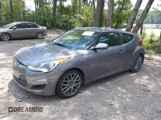 2012 Hyundai Veloster w/Black Int with VIN KMHTC6AD3CU078547, listed as a IAAI auction lot 42633915 with 143,633 mi miles and . Bid and sale history available at DreamBid. Image 2.