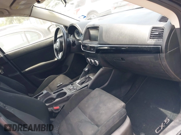 2016 Mazda CX-5 Sport with VIN JM3KE2BY8G0847018, listed as a IAAI auction lot 42064726 with 69,017 mi miles and . Bid and sale history available at DreamBid. Image 5.