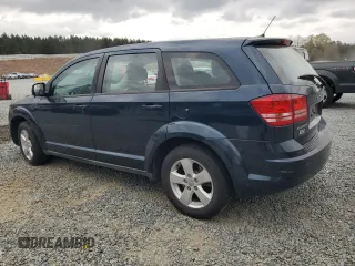 2013 Dodge Journey American Value with VIN 3C4PDCAB6DT577273, listed as a Copart auction lot 50627295 with 139,775 mi miles and Salvage title. Bid and sale history available at DreamBid. Image 2.