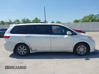 2015 Toyota Sienna XLE with VIN 5TDYK3DCXFS663083, listed as a IAAI auction lot 41967621 with 177,472 mi miles and . Bid and sale history available at DreamBid. Image 13.