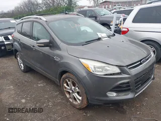 2014 Ford Escape Titanium with VIN 1FMCU0JX2EUA28679, listed as a IAAI auction lot 41930585 with 164,038 mi miles. Bid and sale history available at carsss.com. Image 1.