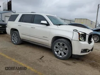 2015 GMC Yukon Denali with VIN 1GKS1CKJ1FR619793, listed as a Copart auction lot 86910314 with 128,559 mi miles and Salvage Title. Bid and sale history available at carsss.com. Image 4.