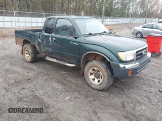 1999 Toyota Tacoma with VIN 4TAWM72N3XZ571550, listed as a IAAI auction lot 41116697 with 402,499 mi miles and . Bid and sale history available at DreamBid. Image 1.