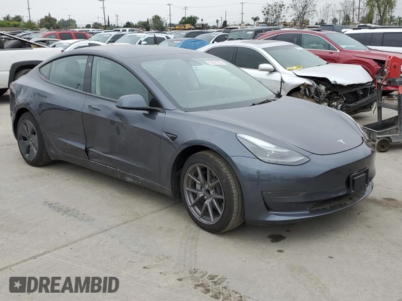 2023 Tesla Model 3 with VIN 5YJ3E1EA3PF697049, listed as a Copart auction lot 55601295 with 12,373 mi miles and Salvage Title. Bid and sale history available at DreamBid. Image 4.