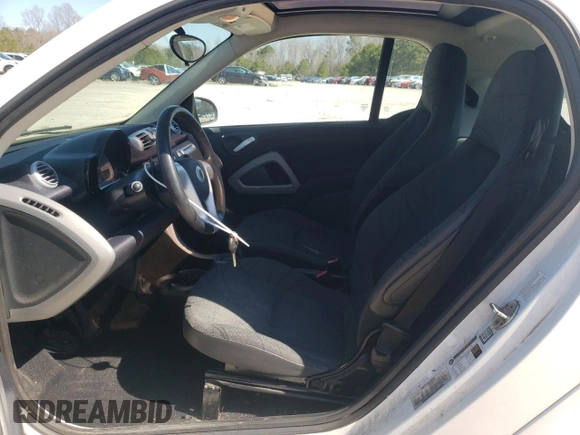 2014 Smart fortwo Pure с VIN WMEEJ3BA0EK780282, выставлен на аукционе Copart как лот 47691815 с пробегом 74 144 миль миль и Чистый • Clean title. История ставок и продаж доступна на DreamBid. Изображение 7.
