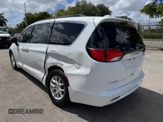 2020 Chrysler Voyager LXI with VIN 2C4RC1DG9LR144605, listed as a Copart auction lot 54107585 with 140,575 mi miles and Salvage Title. Bid and sale history available at carsss.com. Image 2.