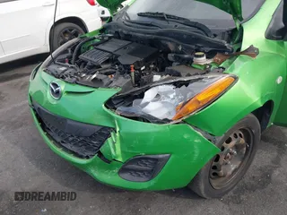 2012 Mazda 2 Sport with VIN JM1DE1KZ4C0140559, listed as a IAAI auction lot 41265959 with 139,364 mi miles and . Bid and sale history available at DreamBid. Image 6.