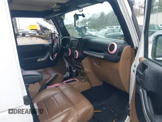 2011 Jeep Wrangler Sahara with VIN 1J4AA5D15BL538240, listed as a IAAI auction lot 41793836 with 172,528 mi miles and . Bid and sale history available at carsss.com. Image 5.