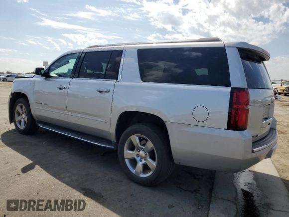 2020 Chevrolet Suburban Premier with VIN 1GNSCJKC0LR216855, listed as a Copart auction lot 72287114 with 94,642 mi miles and Salvage title. Bid and sale history available at DreamBid. Image 2.