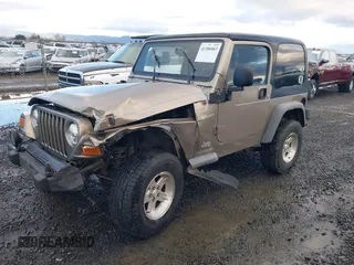 2004 Jeep Wrangler Sport with VIN 1J4FA49S94P711531, listed as a IAAI auction lot 41306863 with 143,720 mi miles and . Bid and sale history available at DreamBid. Image 2.