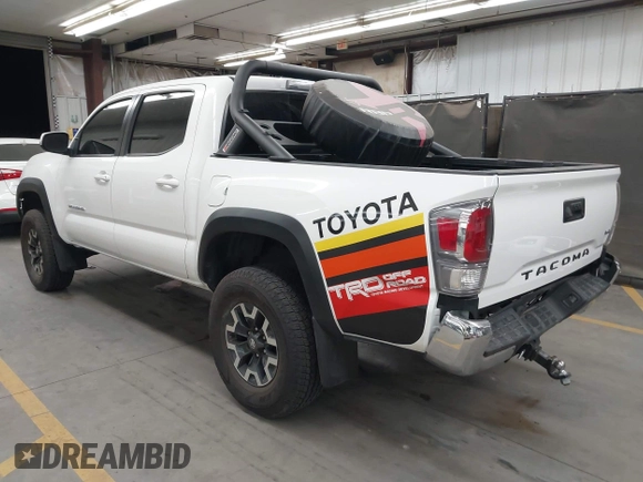 2022 Toyota Tacoma SR with VIN 3TMCZ5AN5NM480311, listed as a IAAI auction lot 42542600 with 43,297 mi miles and . Bid and sale history available at DreamBid. Image 3.