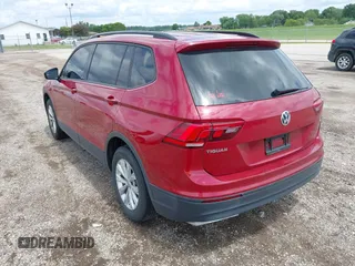 2018 Volkswagen Tiguan S with VIN 3VV1B7AX3JM045193, listed as a IAAI auction lot 42311886 with 69,049 mi miles and . Bid and sale history available at DreamBid. Image 3.