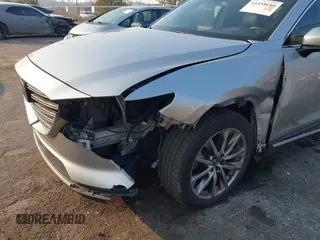 2017 Mazda CX-9 Grand Touring with VIN JM3TCADY5H0138176, listed as a IAAI auction lot 41458610 with 114,664 mi miles and . Bid and sale history available at DreamBid. Image 6.