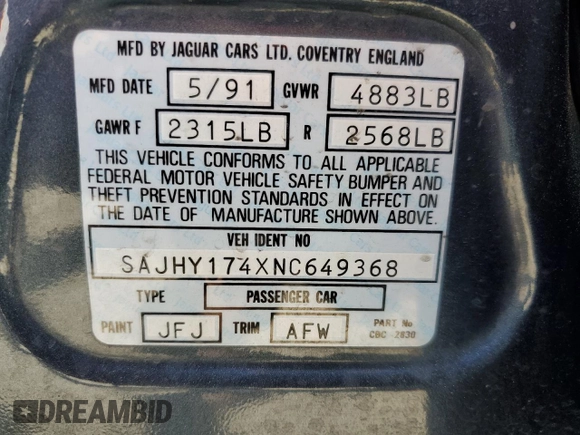 1992 Jaguar XJ with VIN SAJHY174XNC649368, listed as a Copart auction lot 50191454 with 99,553 mi miles and Salvage Title. Bid and sale history available at DreamBid. Image 12.