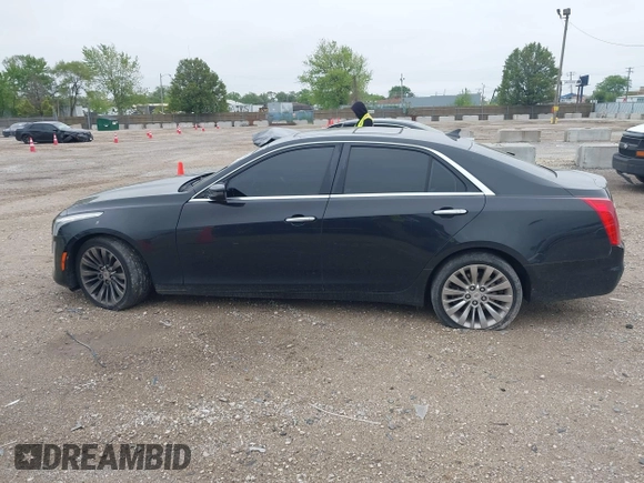 2014 Cadillac CTS Luxury AWD with VIN 1G6AX5SX9E0197395, listed as a IAAI auction lot 42211452 with 90,657 mi miles and . Bid and sale history available at DreamBid. Image 14.