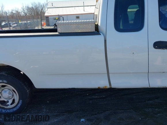 2002 Ford F-150 XL with VIN 1FTRX17L72NA76720, listed as a IAAI auction lot 41738935 with 92,506 mi miles. Bid and sale history available at carsss.com. Image 6.